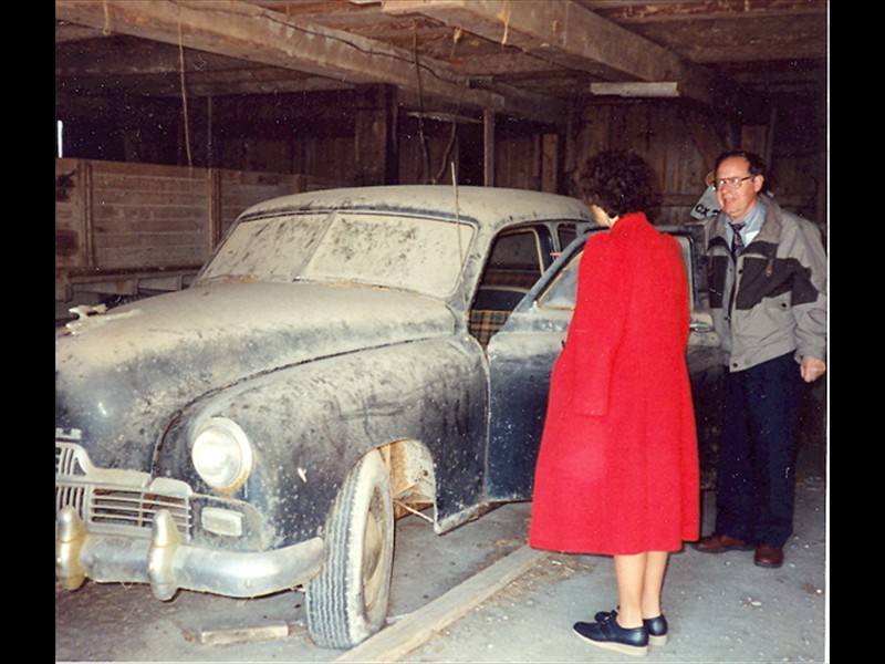 John & Bea inspecting Grandpa's Kaiser stored in barn, 1993